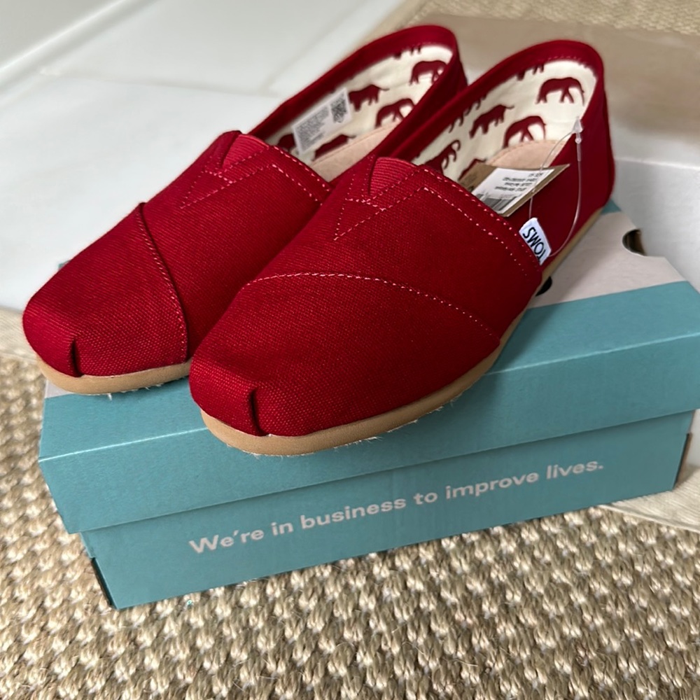 Toms red canvas slip on shoes